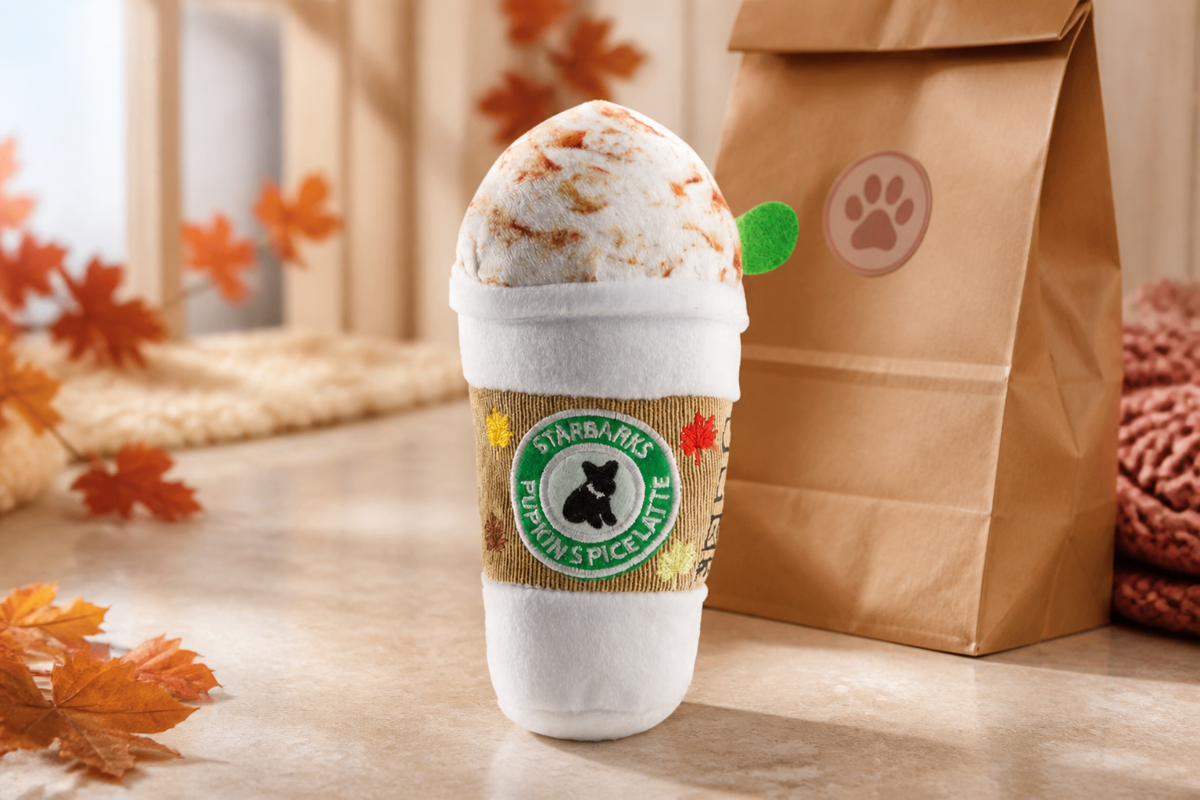 Starbarks Pupkin Spice Latte plush toy in a cozy autumn setting